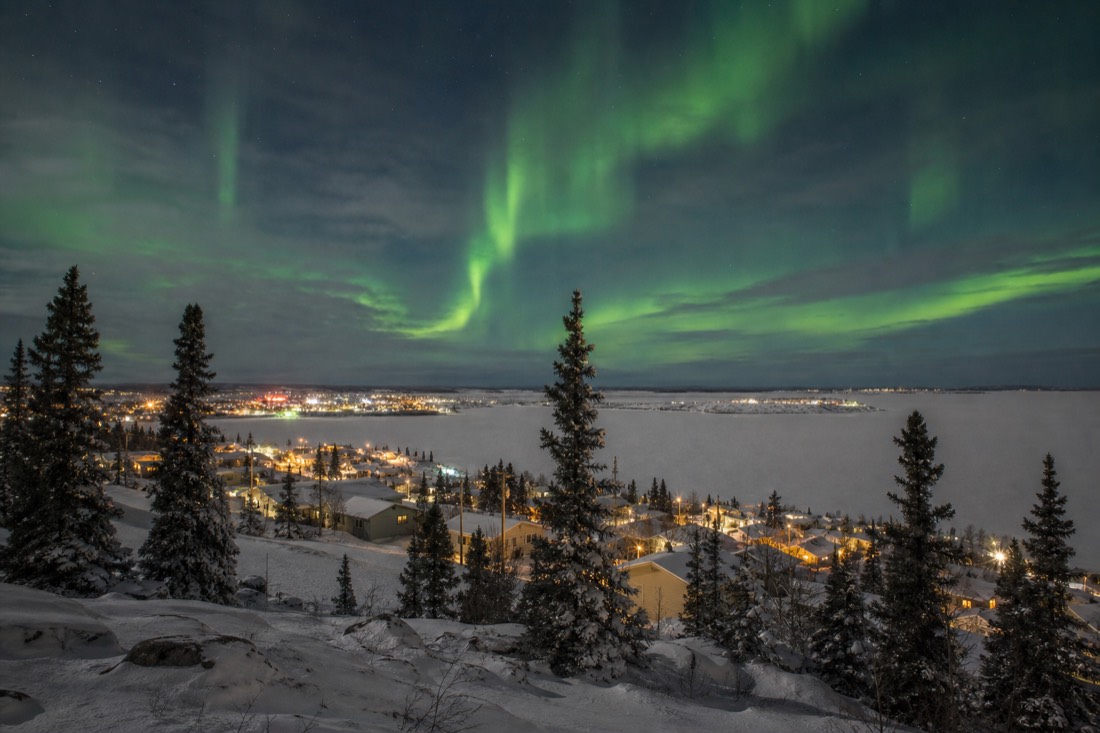 The view over frozen Yellowknife Bay and Old Town rooftops from the Bush Pilots Monument in winter